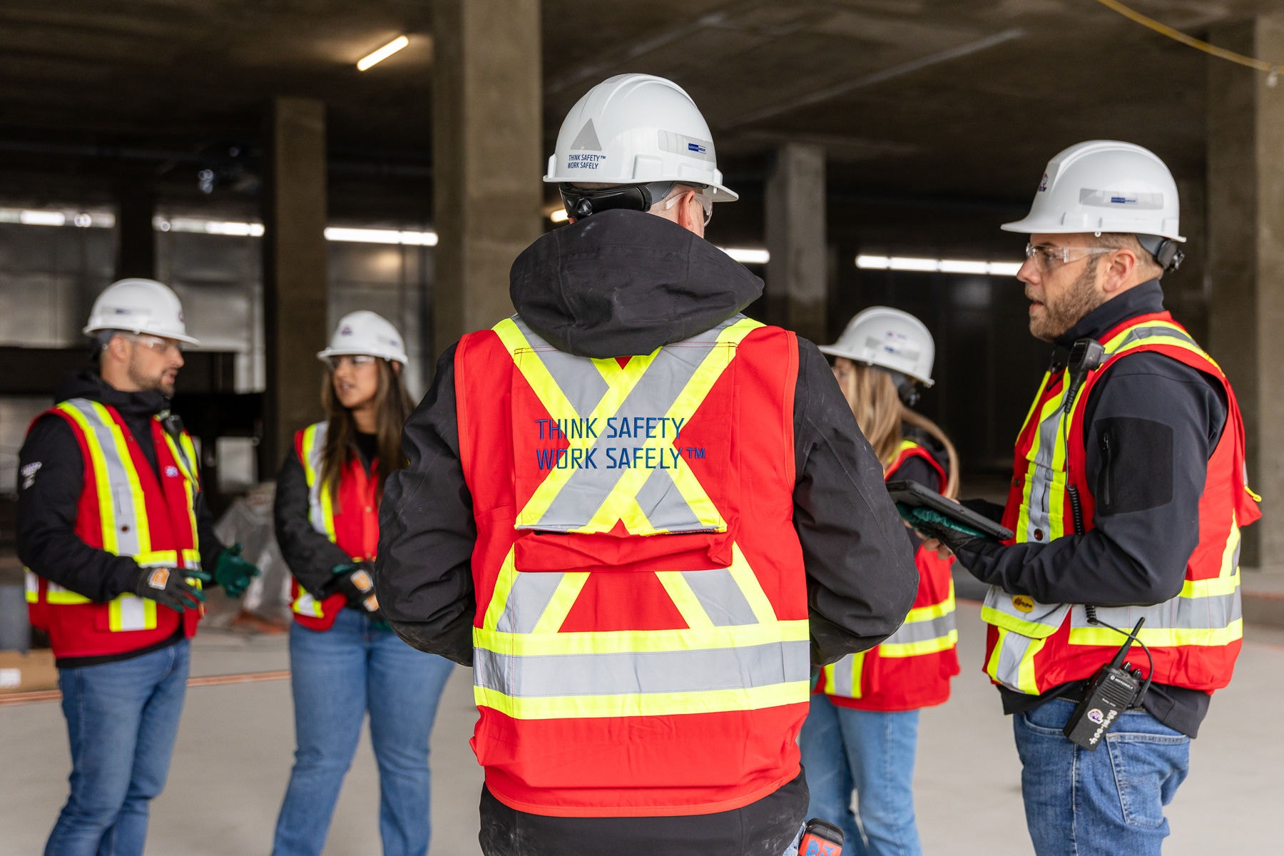 A group of Ledcor on-site workers in discussion